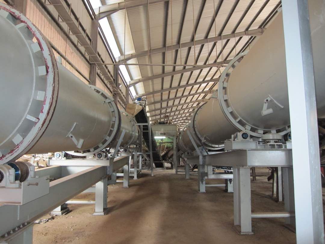 A factory with a lot of pipes going through it