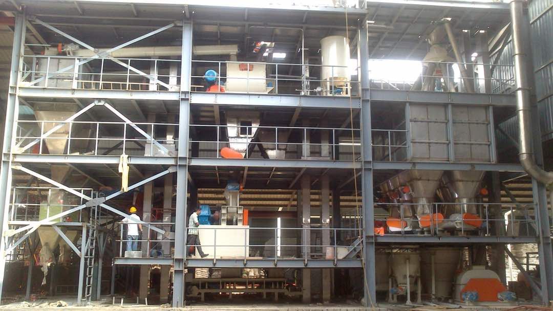 A large industrial building with a lot of machinery in it.