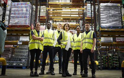 Temp Jobs — Group Portrait of Staff at Distribution Warehouse in Cullman, AL