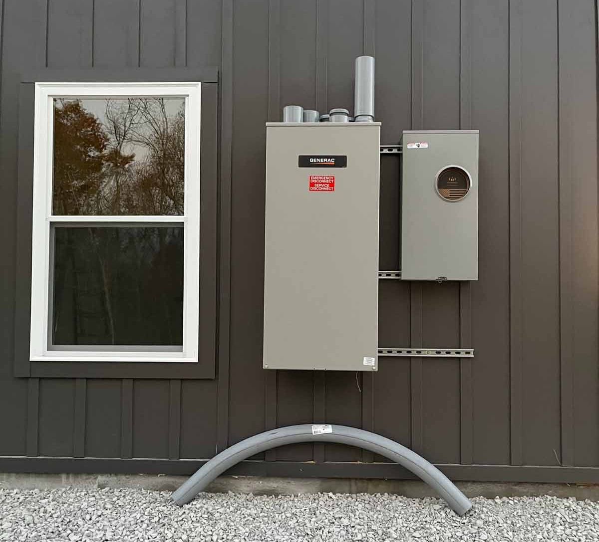 A car is parked in front of a house at night