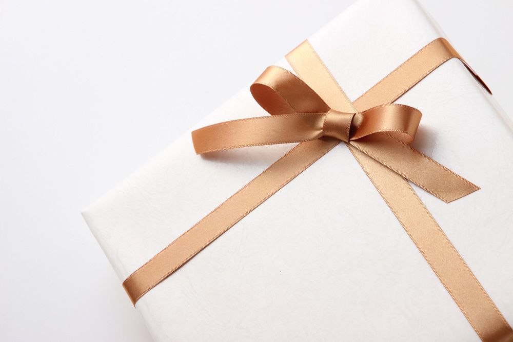 White Gift Box With a Gold Ribbon Tied in a Bow — J'adore Flowers & Gifts Cairns In Earlville, QLD