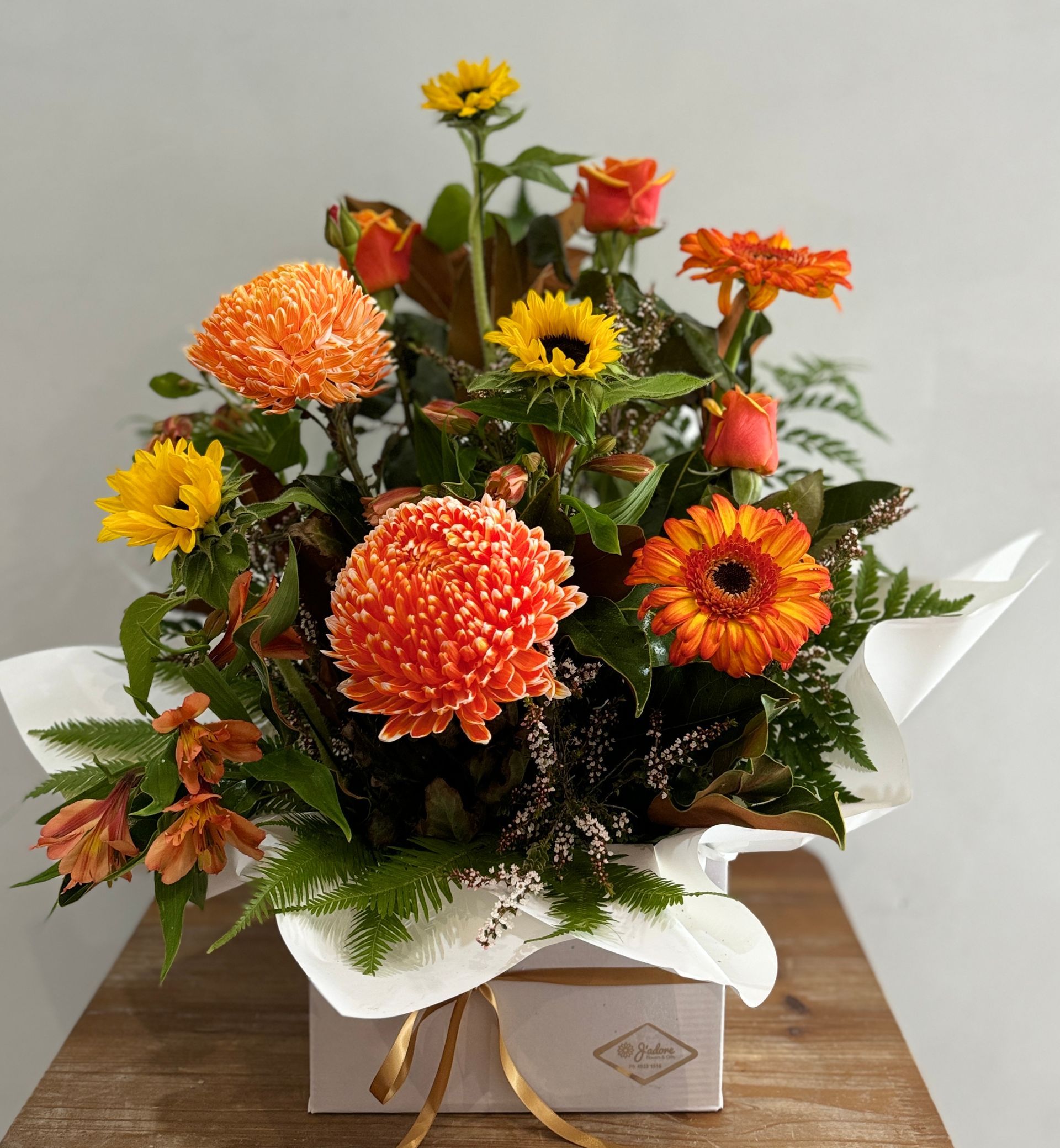 Orange and Yellow Floral Arrangement in a White Square Box — J'adore Flowers & Gifts Cairns In Earlville, QLD