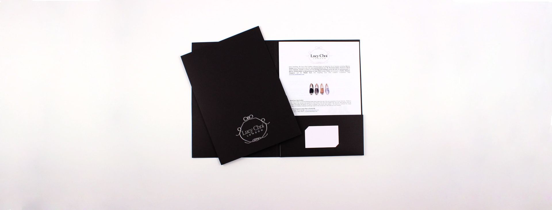 Black folder with papers against a white background.