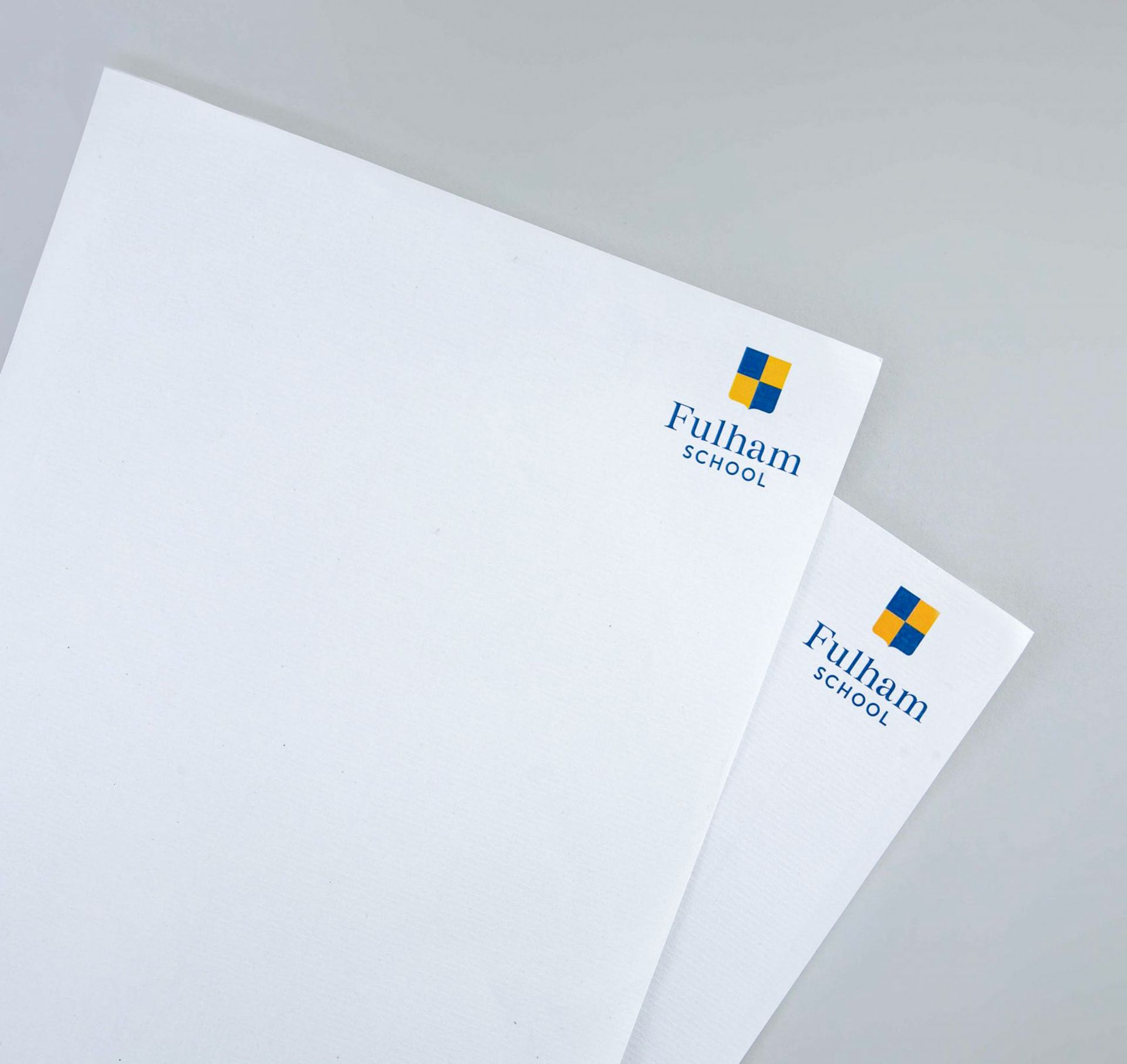 White letterhead sheets with the Fulham School logo printed at the top right corner.