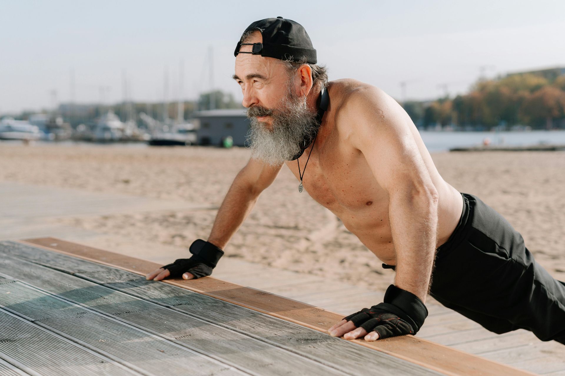 A group of women are doing plank exercises in a gym.