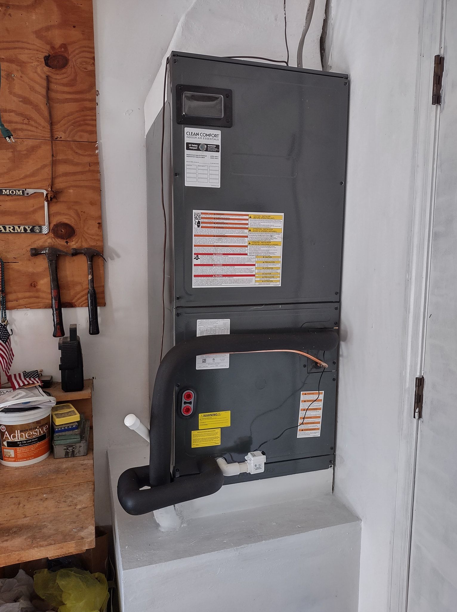 a couple of boxes stacked on top of each other on a wall .