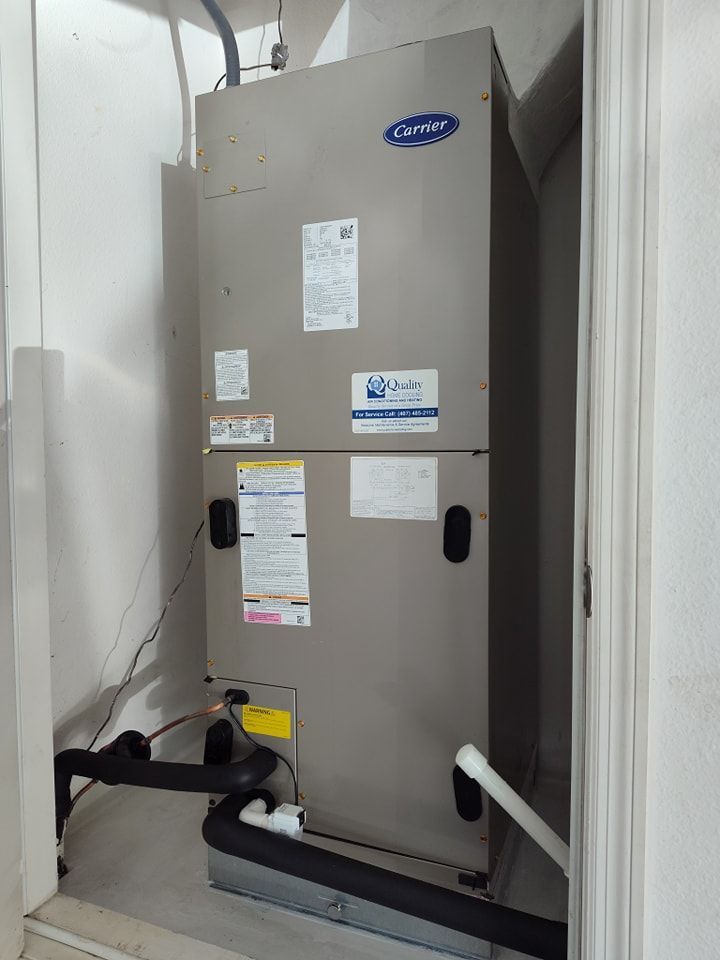 a carrier air conditioner is sitting in a room next to a door