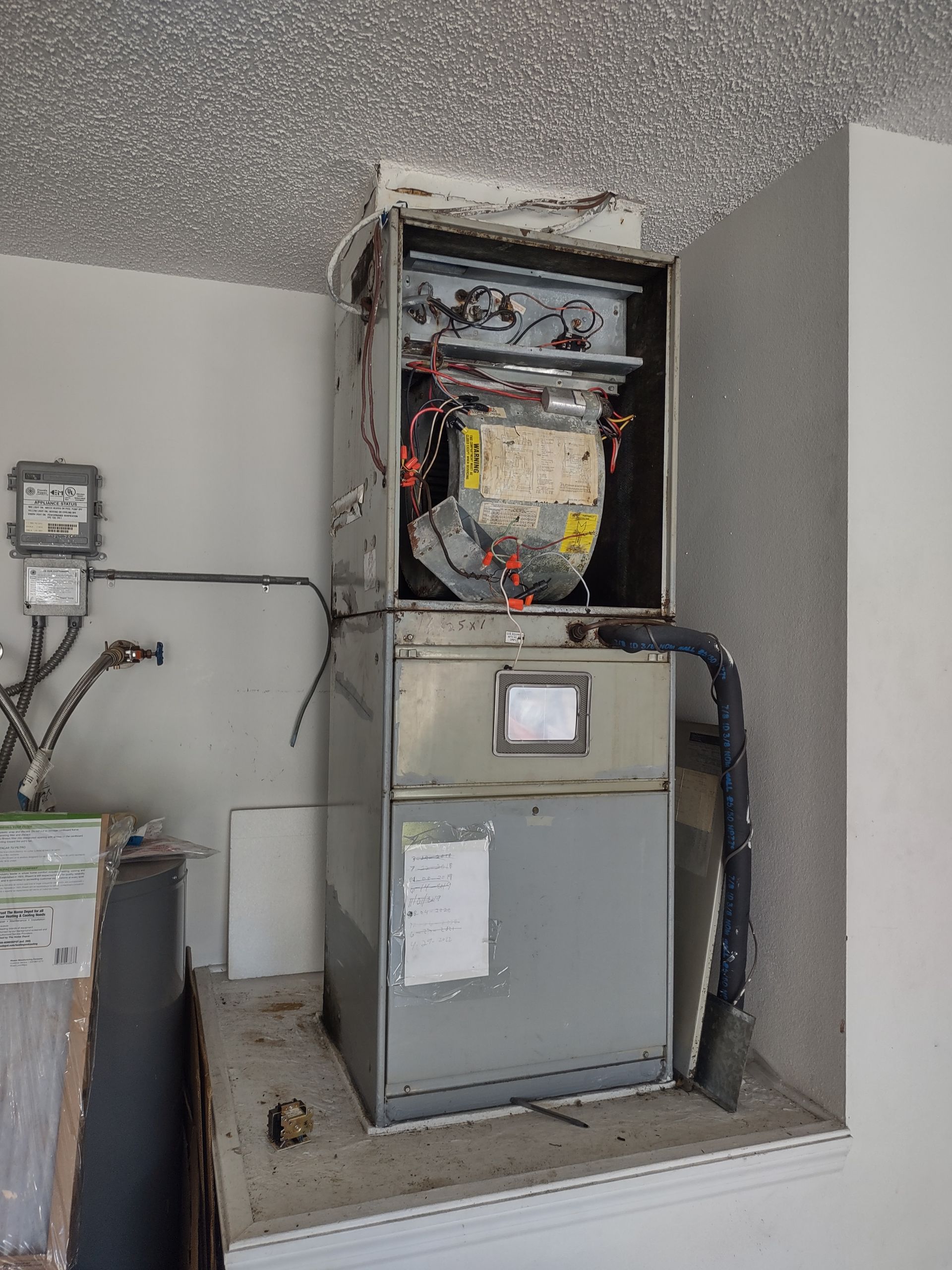 a furnace is sitting on top of a shelf in a room .