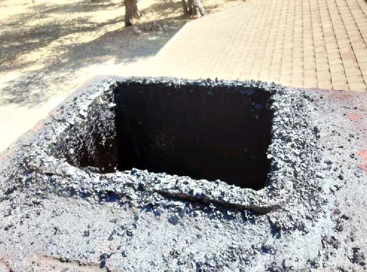 Thick creosote buildup inside chimney flue before professional chimney cleaning service.