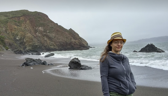 Three Lit Candles Are on a Tray on a Table