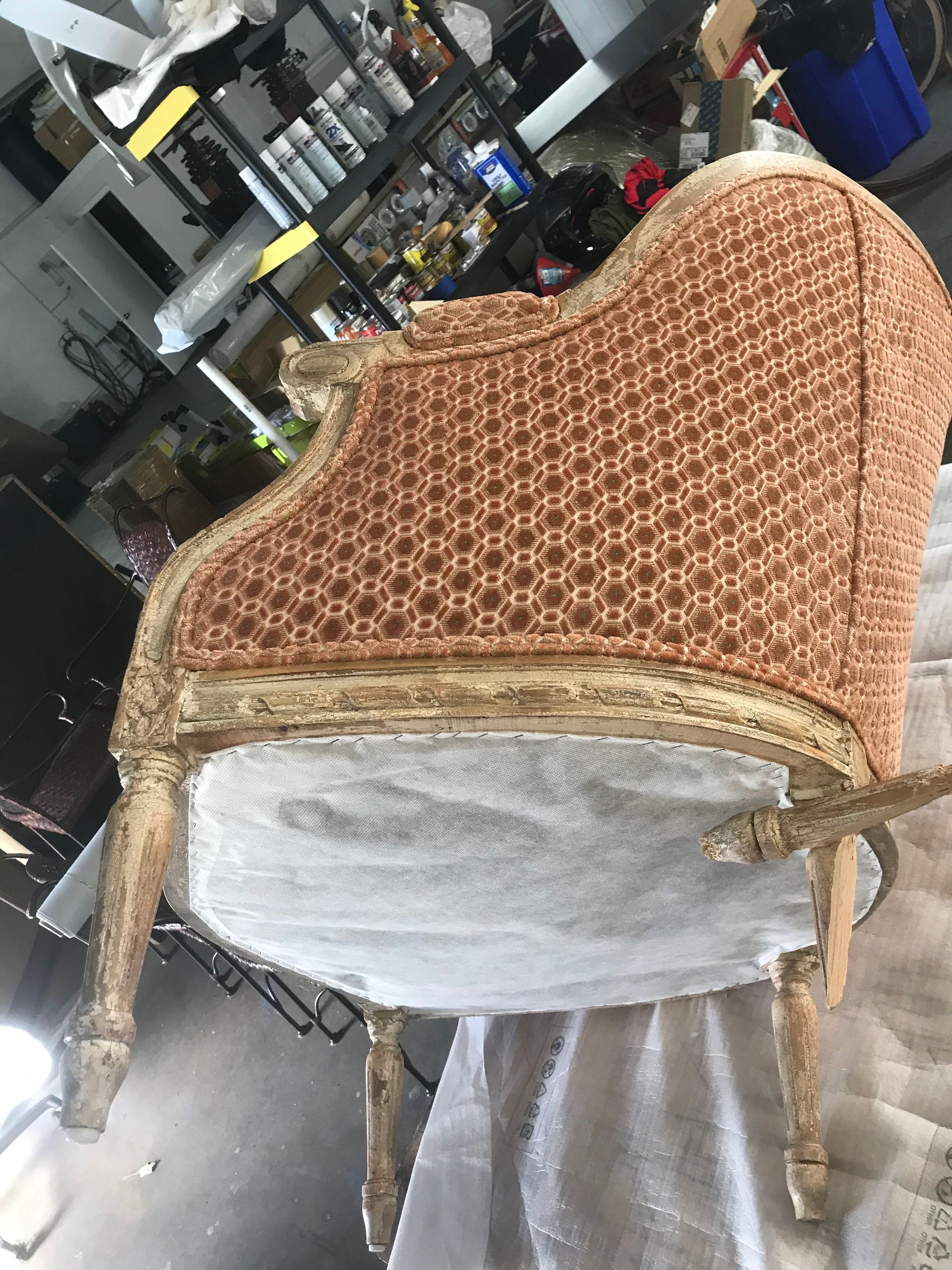 A chair is sitting on a table in a room.