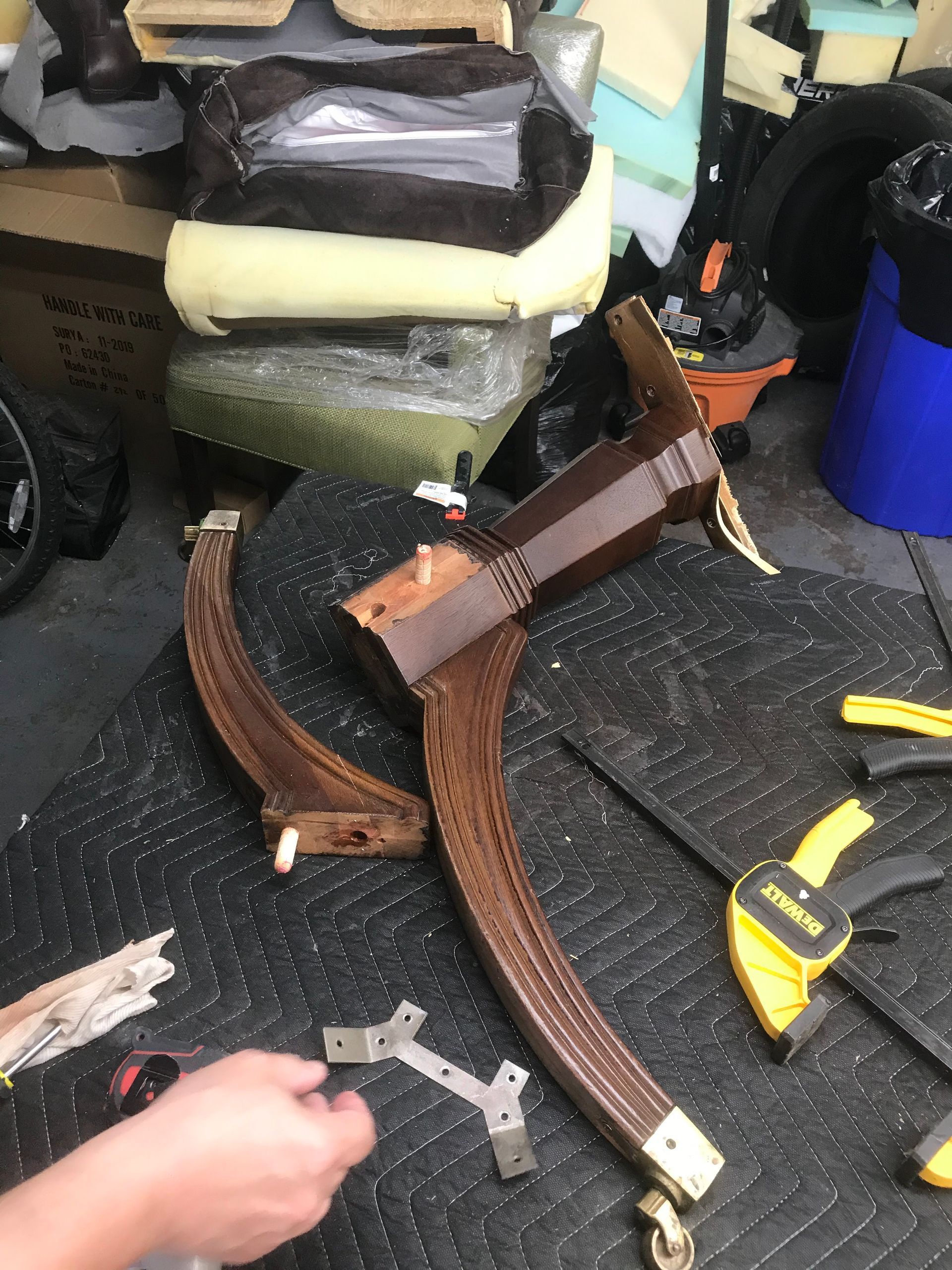 A person is working on a piece of wood on a table