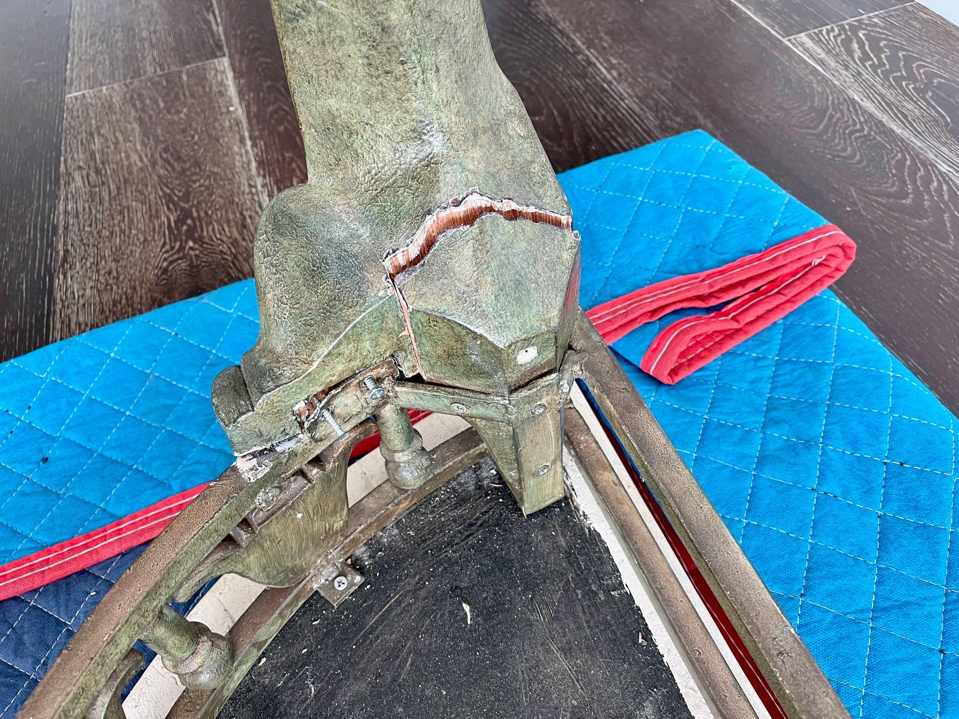 A picture frame is sitting on top of a blue blanket.