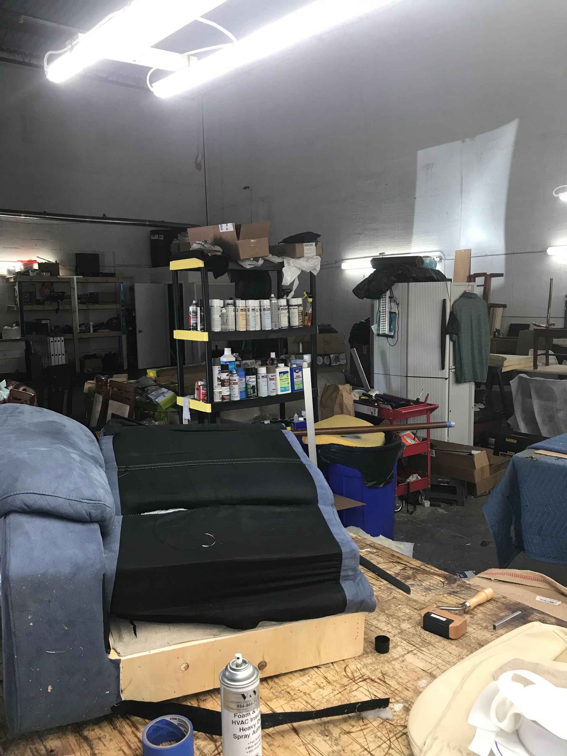 A room with a lot of furniture and tools in it