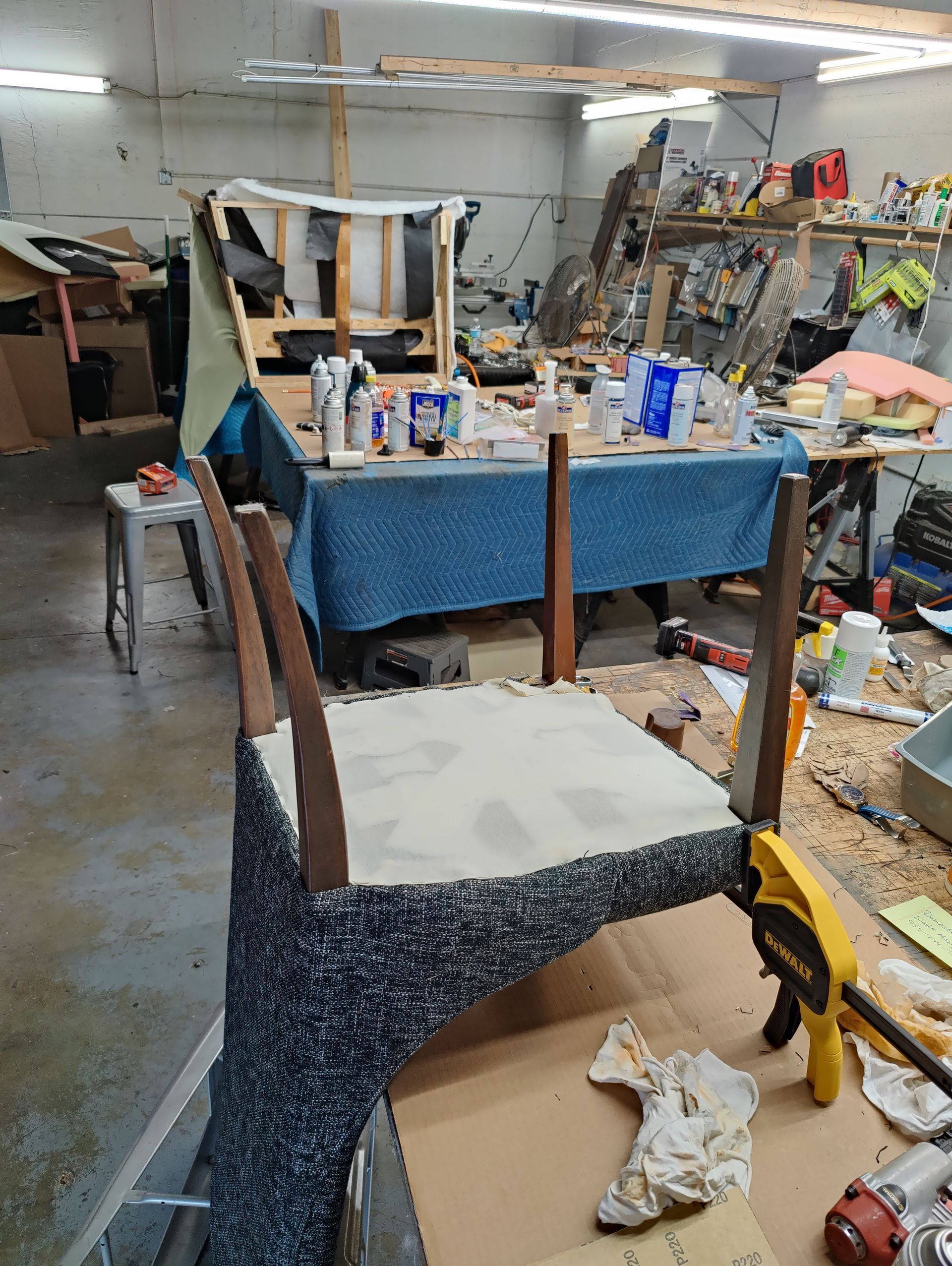 A chair is being repaired in a workshop.