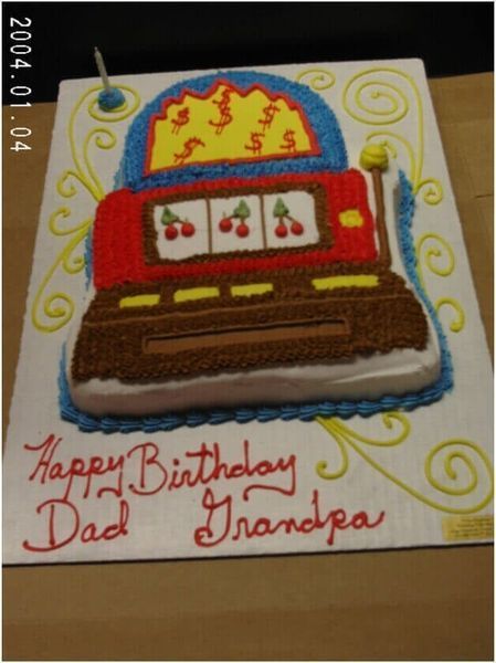 Cake decorated as a slot machine with cherries, inscribed 