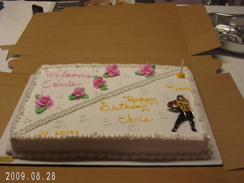 Birthday cake decorated with frosting roses and a football player, with text 