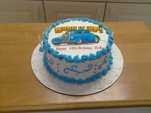 Birthday cake with a blue classic car graphic and 