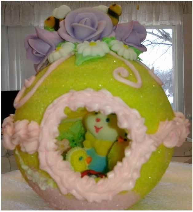 Easter egg decoration with bunny and chick inside, lavender roses, bees, and pink frosting.