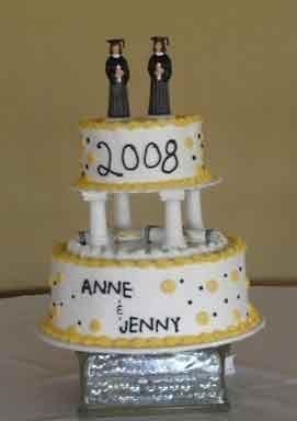 Two-tiered graduation cake, white with yellow accents and 