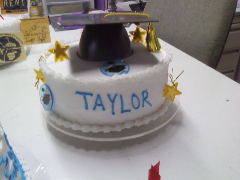 Cake decorated for graduation, white frosting, blue 