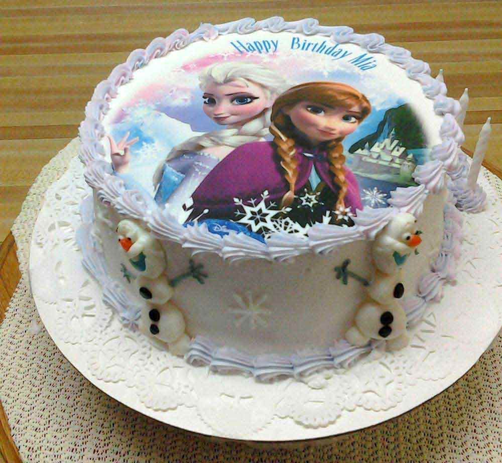 Frozen-themed birthday cake with Elsa and Anna, Olaf, and 