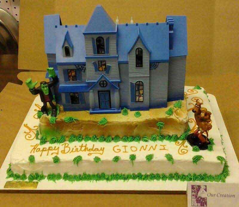 Cake decorated with blue house and characters, 