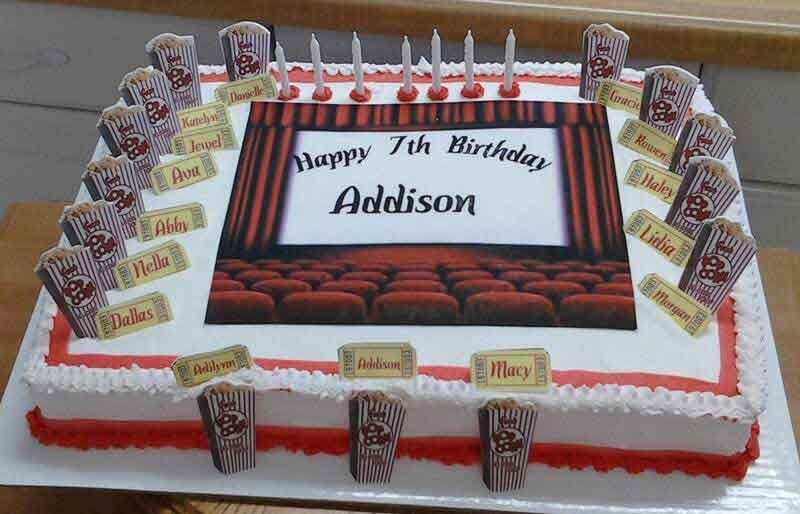 Birthday cake with theatre design, popcorn, and name 