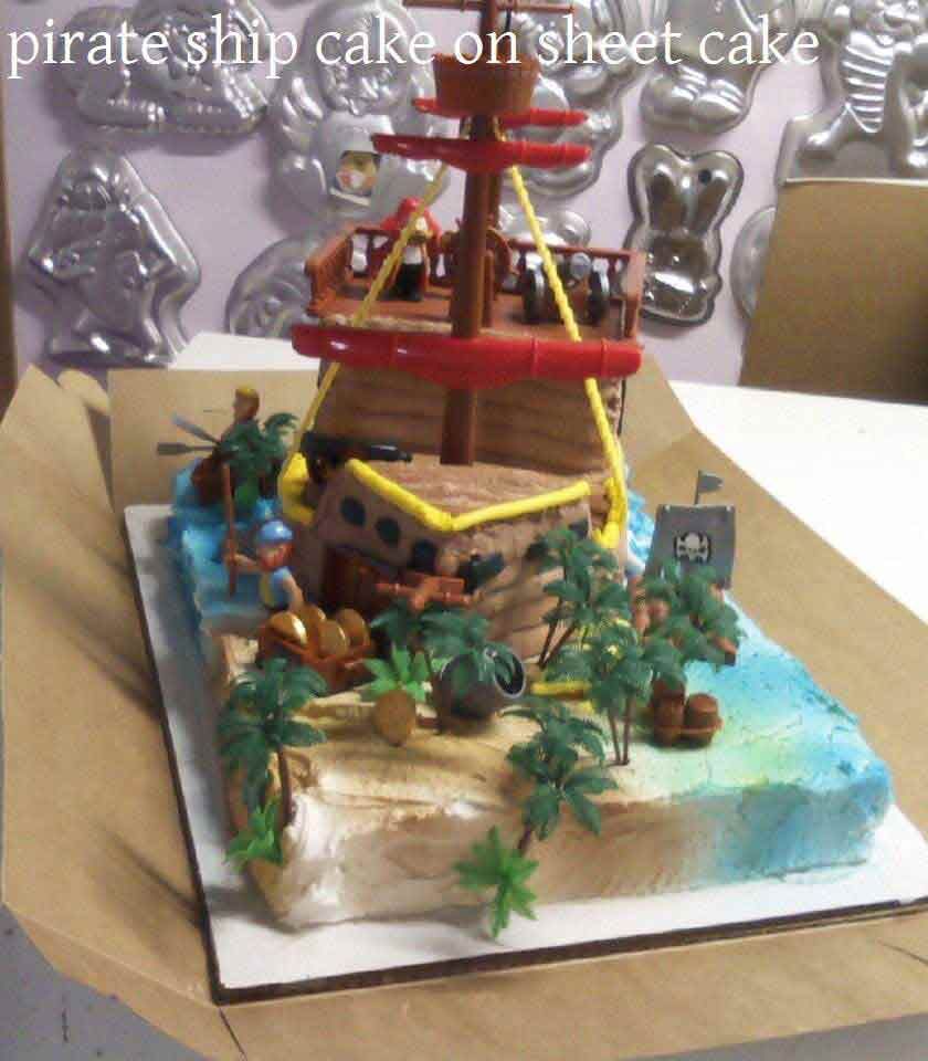 Pirate ship cake on a sheet cake with ocean, figures, and details.