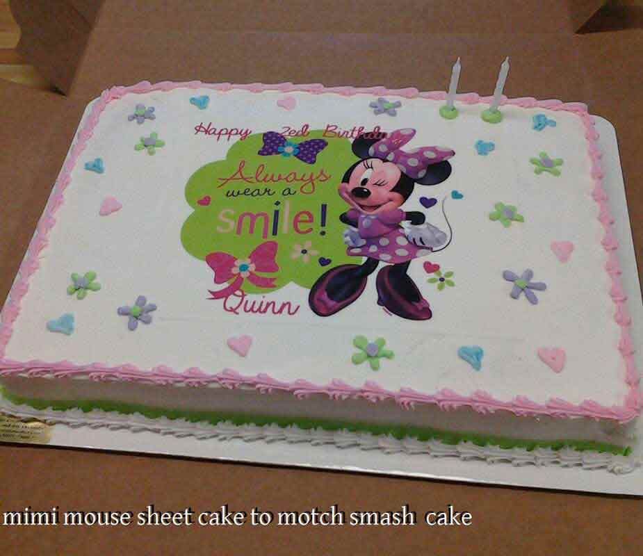 Minnie Mouse birthday cake with flowers and the words 