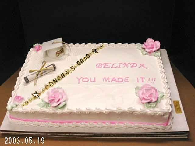 Graduation cake with pink roses and text 