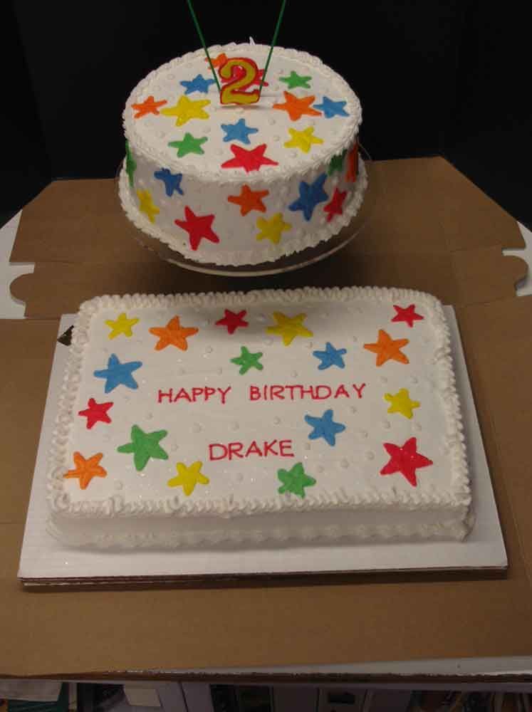 Two birthday cakes: a round cake with a 