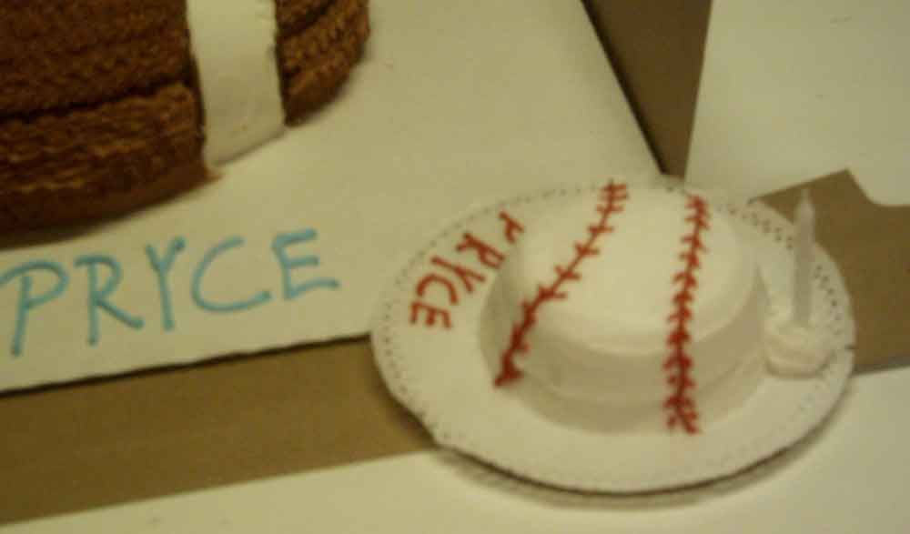 Baseball-themed cake with red stitching, 
