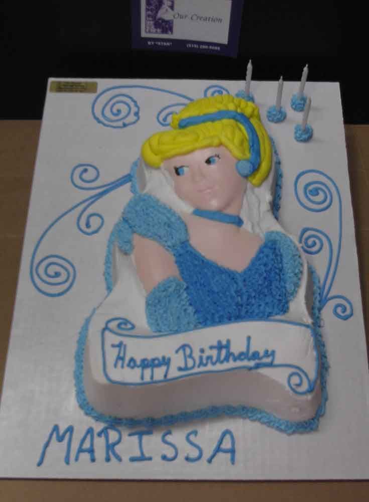 Cinderella birthday cake with blue frosting, scroll banner reading 