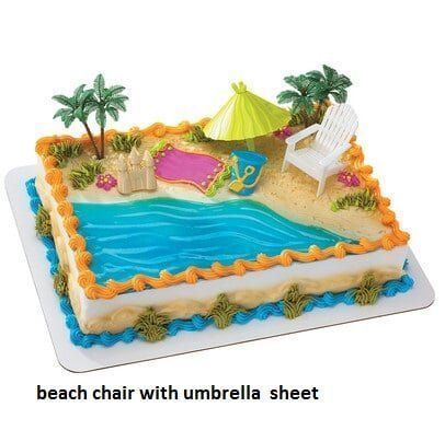 Beach-themed cake with blue water, sand, palm trees, a beach chair, umbrella, and decorative frosting.