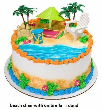 Beach-themed round cake with ocean, sand, palm trees, sand castle, beach chair, and umbrella decorations.
