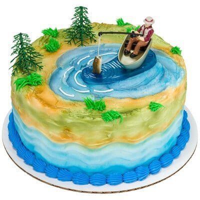 Cake decorated with a lake scene, featuring a fisherman in a boat and a caught fish.