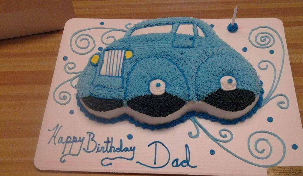 Blue car-shaped birthday cake with 
