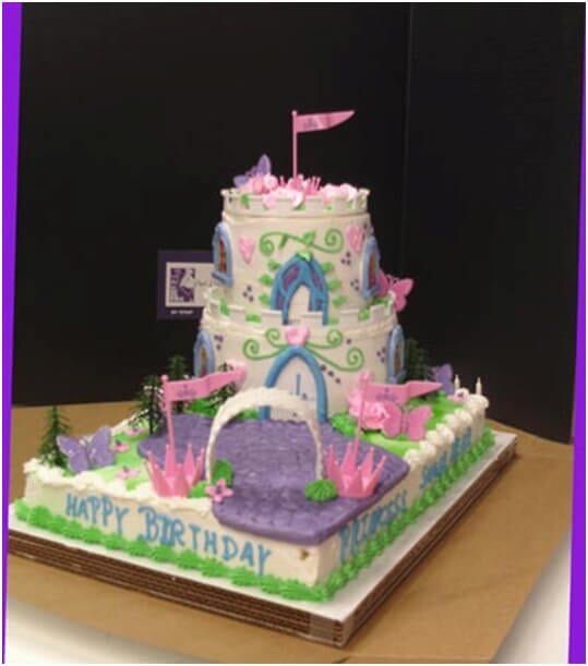 Two-tiered castle cake with pink and purple accents, 