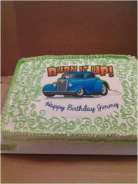 Cake with a blue hot rod image, green swirls, and the text 