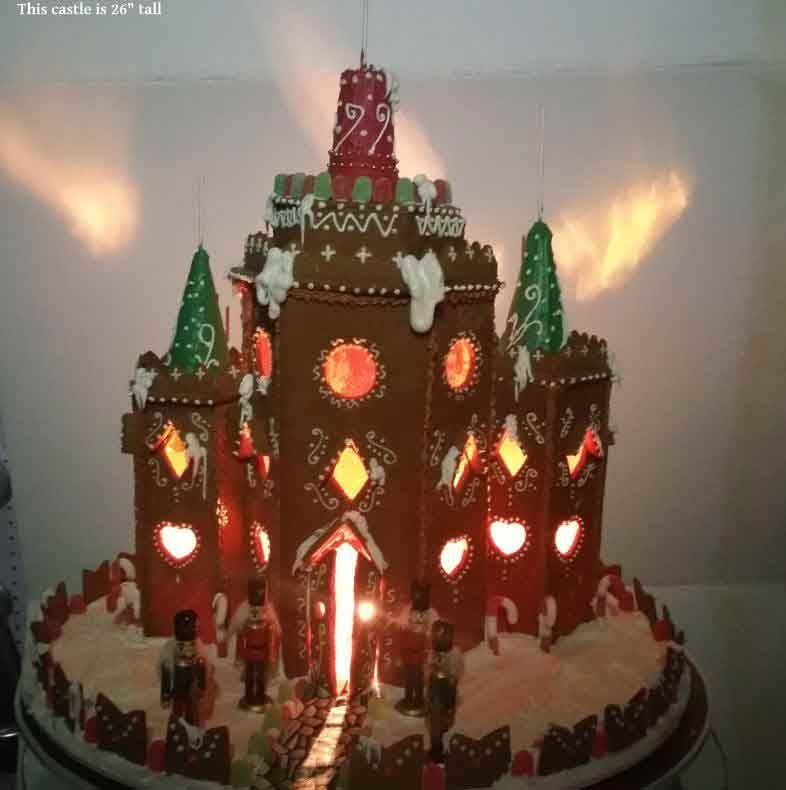 Gingerbread castle with lit windows, snow accents, and toy soldiers.