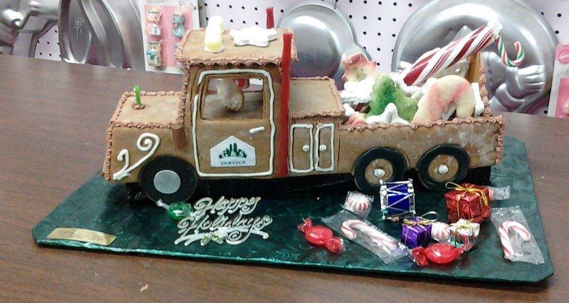 Gingerbread truck decorated for Christmas with candy.