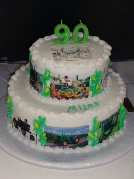 Two-tier cake with tractor images and 