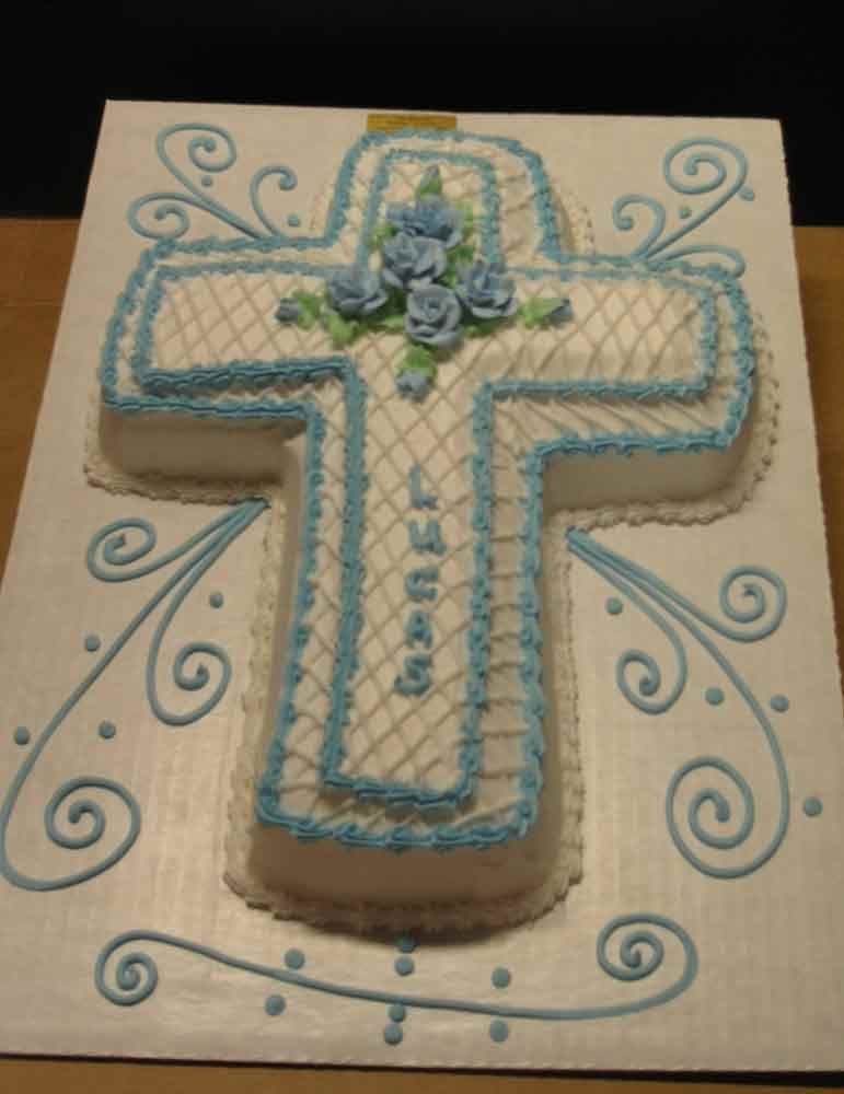 Cross-shaped cake decorated with blue icing and flowers, 