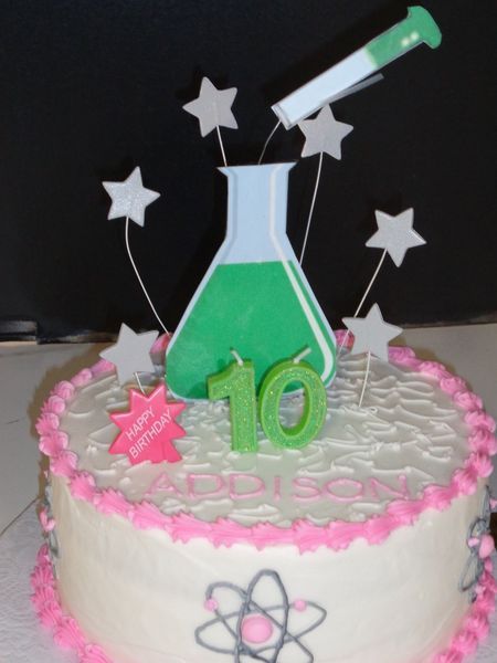 Birthday cake with science theme: beaker, test tube, stars, 