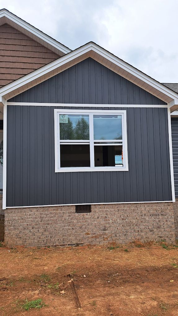 A house with a large window on the side of it