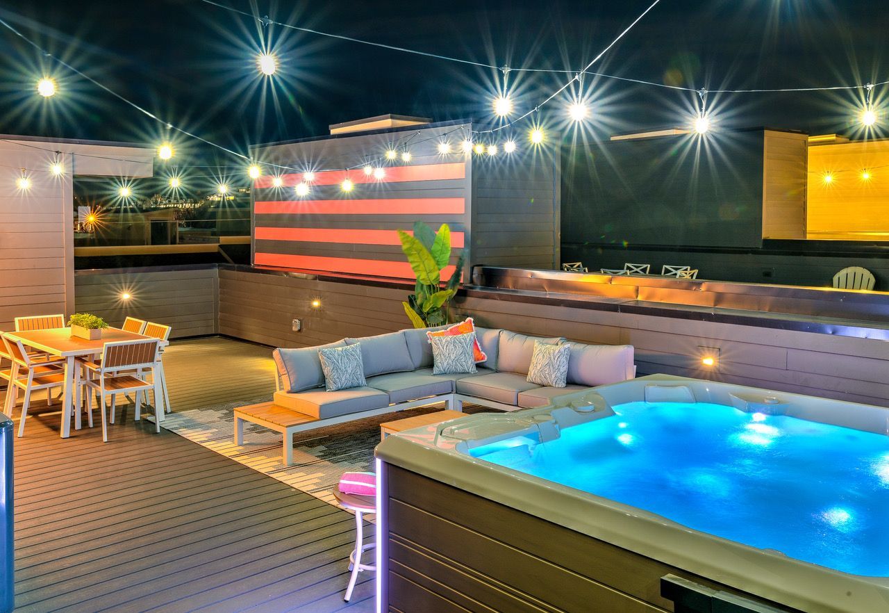 There is a swimming pool on the roof of a building.