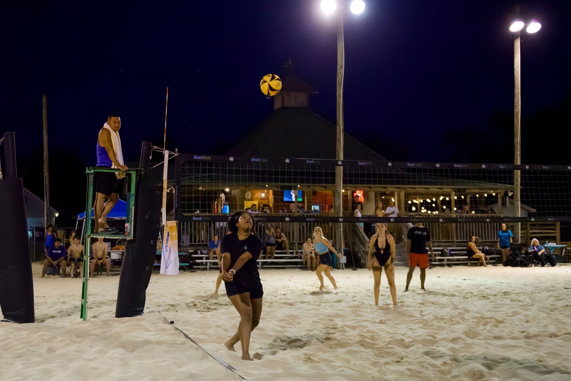 Baseball on a dark surface, with visible stitching.