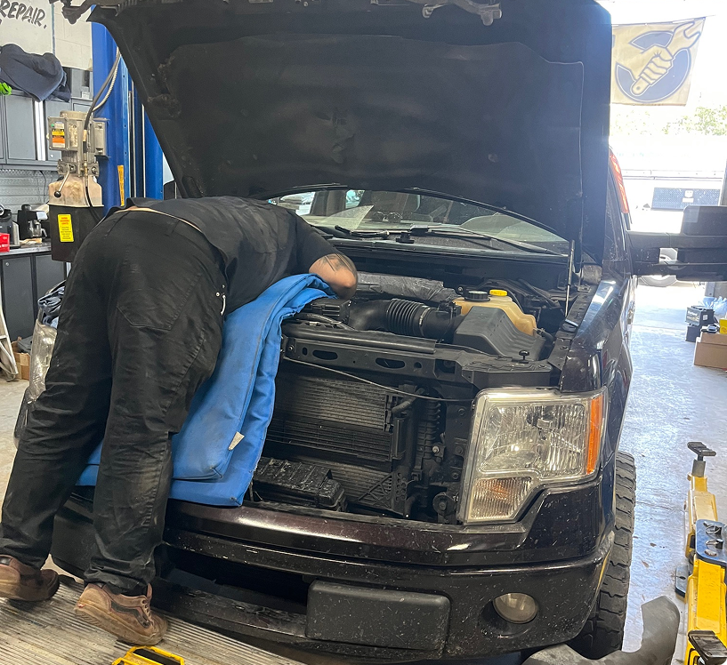 auto repair team standing in garage | Oscar's Automotive