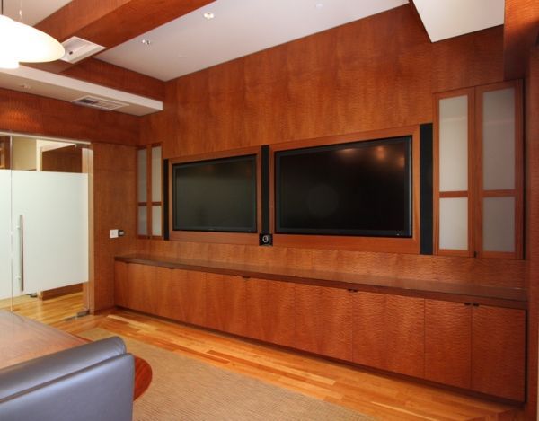 A living room with a large flat screen tv on the wall